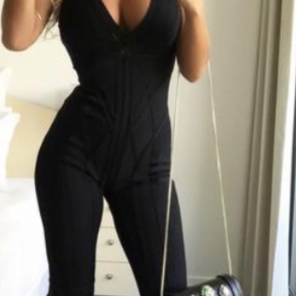 Black one piece bandage catsuit .